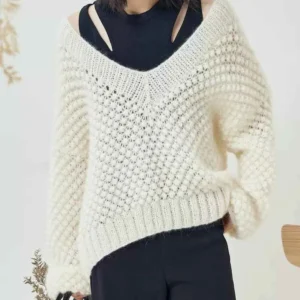 Manufacturer of hand-woven crochet floral knit cardigans